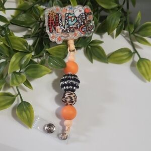Beaded Badge Reel with Orange and Black Accents